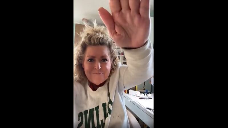 Laura Smith saluting her TikTok followers.