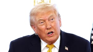 President Donald Trump calls service members on Christmas Eve at the Mar-a-Lago resort on December 24, 2025 in Palm Beach, Florida. Trump is spending the holidays in Florida this year.