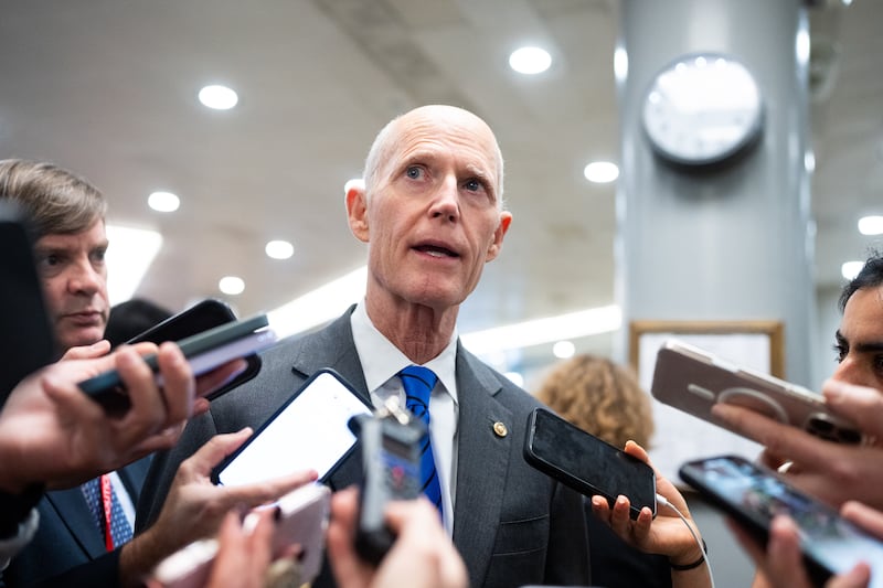 Florida Sen. Rick Scott speaks to reporters as he arrives in the U.S. Capitol for a vote on Tuesday, January 06, 2026.