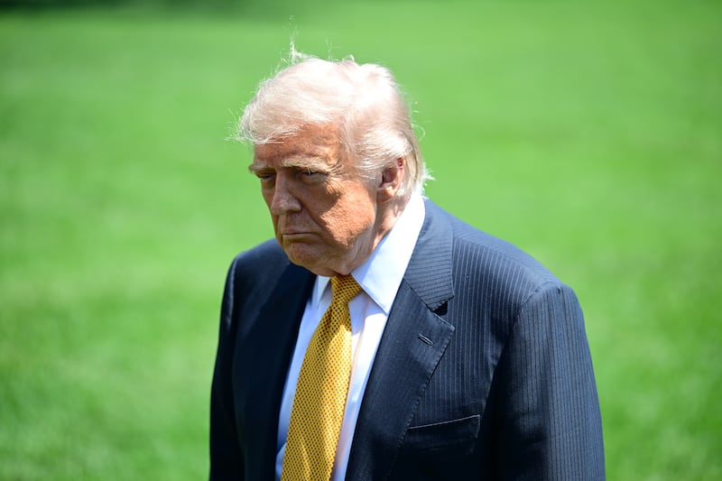 WASHINGTON, UNITED STATES - MAY 12: U.S. President Donald Trump speaks to members of the press before boarding Marine One on the South Lawn of the White House in Washington, United States, on May 12, 2026.