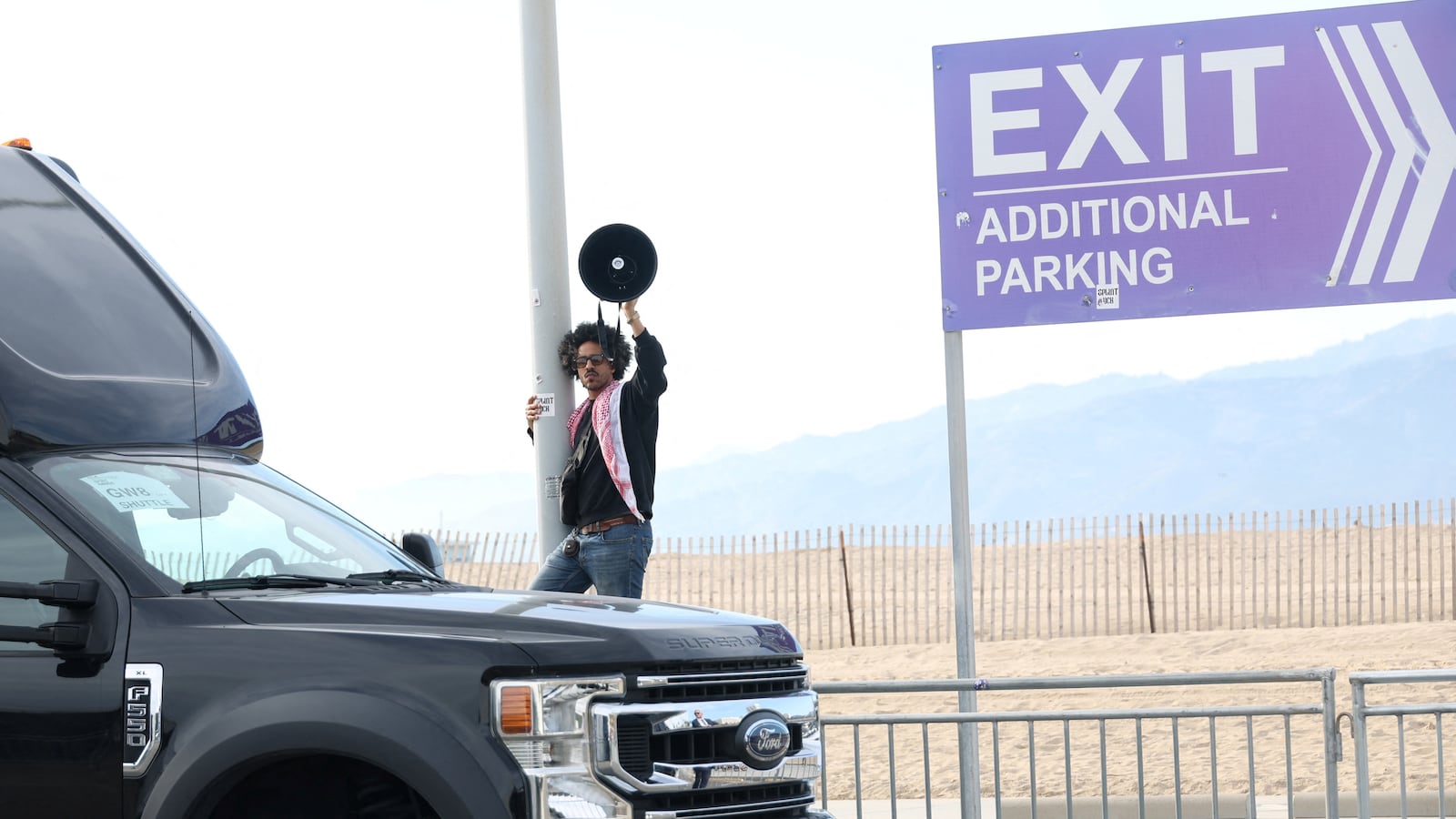 A person protests in support of Palestinians using a megaphone outside the 39th Film Independent Spirit Awards venue, in Santa Monica, California, U.S. February 25, 2024.