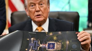 US President Donald Trump shows a rendering of the upcoming "UFC Freedom 250" event