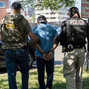 Agents from Immigration and Customs Enforcement (ICE) detain an immigrant after a court hearing at the Connecticut Superior Court on July 03, 2025 in Stamford, Connecticut. Masked federal officers, including ICE and FBI agents staked out the court facility and detained multiple immigrants following their court appearances. ERO stands for Enforcement and Removal Operations, a division of ICE.