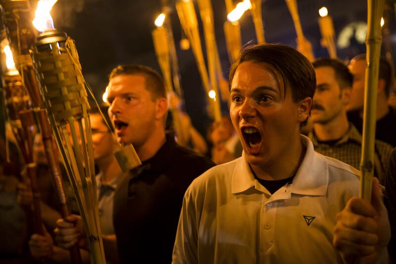 Neo Nazis, Alt-Right, and White Supremacists encircle and chant during the Charlottesville rally on August 11, 2017.
