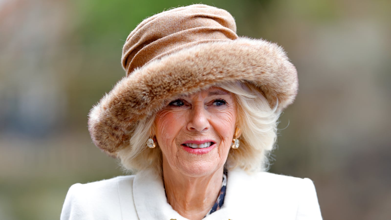 Queen Camilla (wearing the late Queen Elizabeth II’s gold, diamond and sapphire flower brooches) attends the Royal Maundy Service at Worcester Cathedral on March 28, 2024, in Worcester, England.
