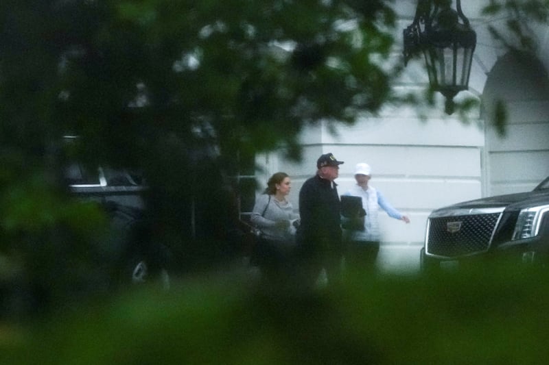 US President Donald Trump walks with his Executive Assistant Natalie Harp, as he departs the White House in Washington, D.C., US, October 4, 2026. REUTERS/Aaron Schwartz