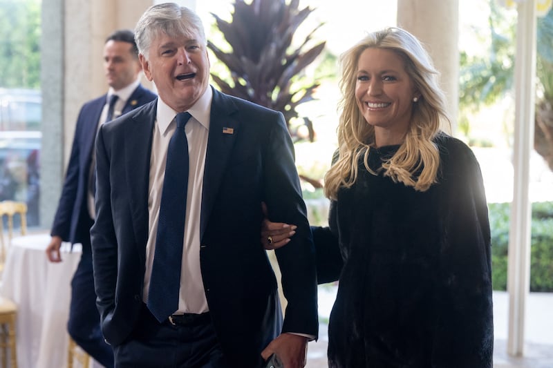 (L/R) Fox News host Sean Hannity and his fiance, Fox News host Ainsley Earhardt, arrive to attend the wedding of Dan Scavino, White House Deputy Chief of Staff, and Erin Elmore, the Department of State Director of Art in Embassies, at Mar-a-Lago in Palm Beach, Florida, February 1, 2026. (Photo by SAUL LOEB / AFP via Getty Images)