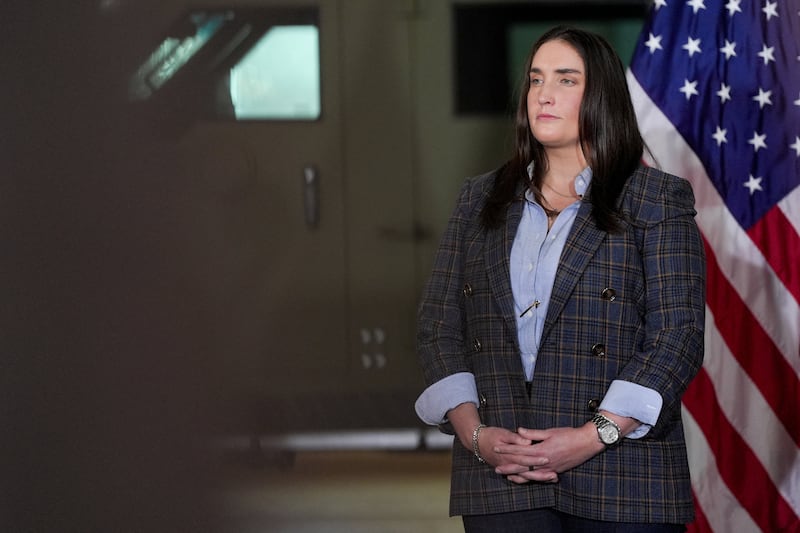 Immigration and Customs Enforcement (ICE) Deputy Director Madison Sheahan attends a press conference about 'Operation Midway Blitz', an immigration enforcement campaign, from a hangar in Gary, Indiana, U.S., October 30, 2025.