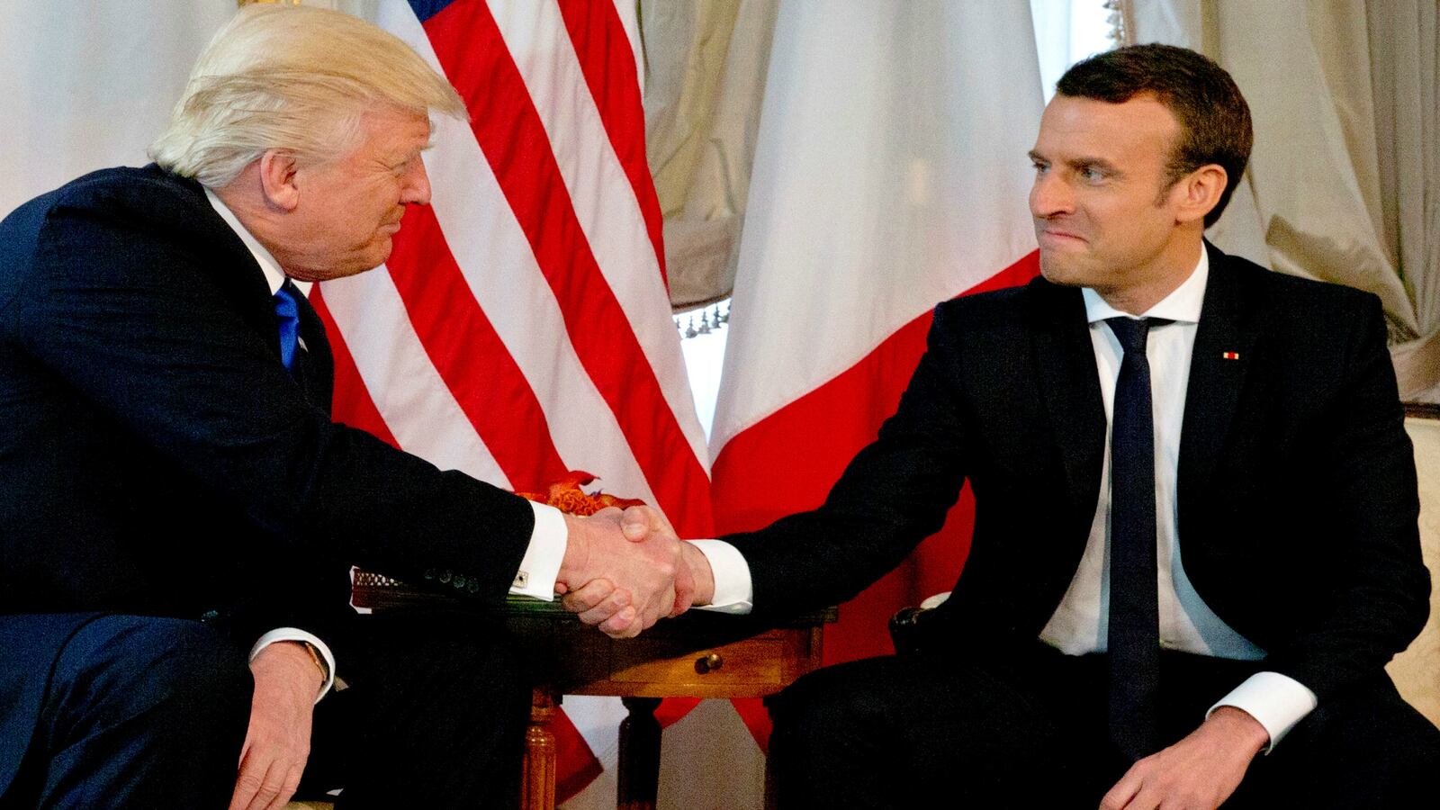 170528-marcon-trump-handshake-signal-cheat_n79fhu