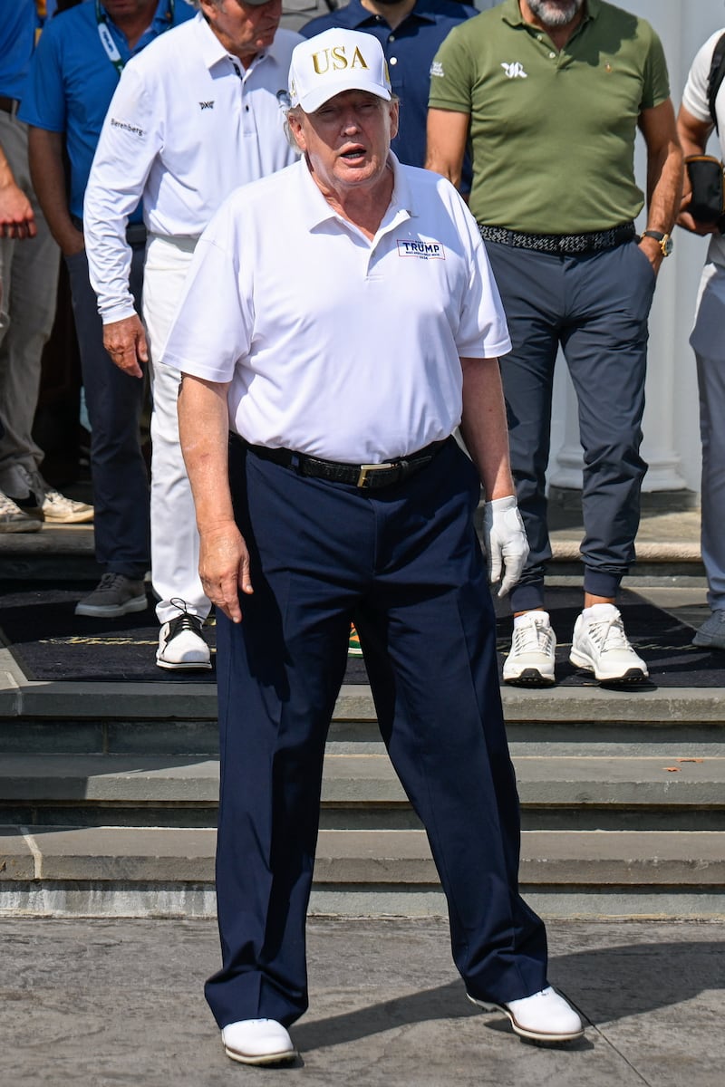 Aug 9, 2026; Bedminster, New Jersey, USA; President Donald Trump walks out of the clubhouse before the final round of the LIV Golf New York tournament at Trump National Bedminster. Mandatory Credit: Dennis Schneidler-Imagn Images