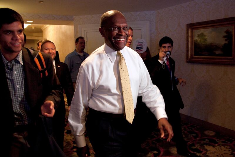 articles/2011/10/09/herman-cain-social-conservatives-new-darling-at-values-voter-summit/romney-cain-values-voters-goldberg_goq63q