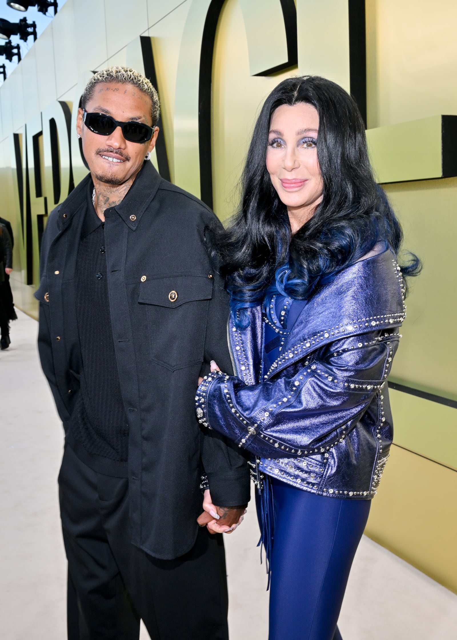 Alexander A.E. Edwards and Cher at the Versace Fall-Winter 2023 Fashion Show held at Pacific Design Center on March 9, 2023 in West Hollywood, California. (Photo by Michael Buckner/Variety via Getty Images)
