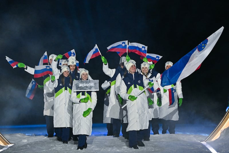 Slovenia's flag bearer Nika Prevc (C) parades during the opening ceremony of the Milano Cortina 2026 Winter Olympic Games at the Predazzo Ski Jumping Stadium in Predazzo (Val di Fiemme), on February 6, 2026. (Photo by Javier SORIANO / AFP via Getty Images)