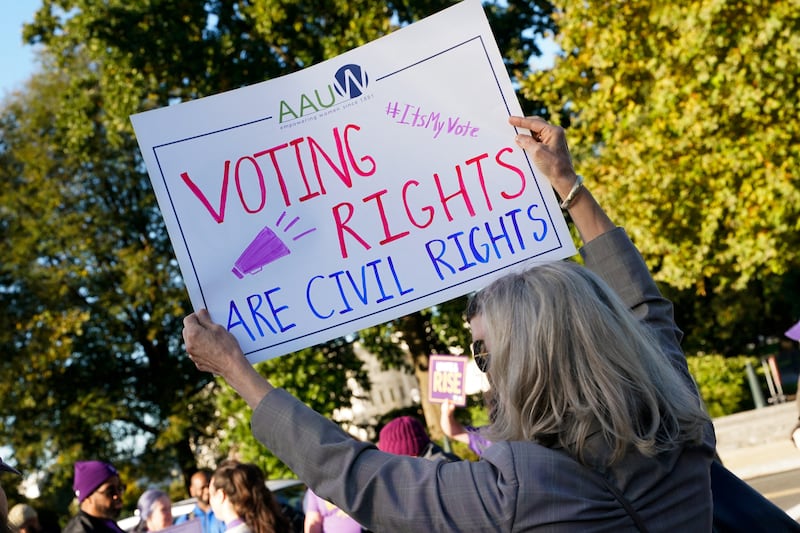 People protest on the day the U.S. Supreme Court hears arguments regarding the composition of Louisiana electoral districts, in Washington, D.C., U.S., October 15, 2025.