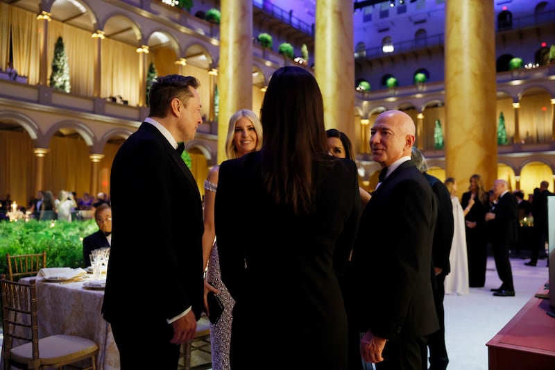 WASHINGTON, DC - JANUARY 19: (L-R) Elon Musk, Ivanka Trump, and Jeff Bezos speak to one another at a candlelight dinner for U.S. President-elect Donald Trump at the National Building Museum on January 19, 2025 in Washington, DC. Trump will be sworn in as the 47th U.S. president on January 20. (Photo by Anna Moneymaker/Getty Images)
