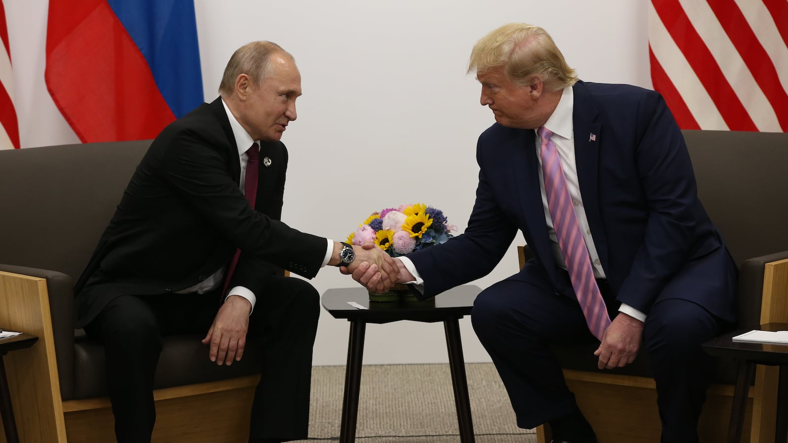U.S. President Donald Trump greets Russian President Vladimir Putin during their bilateral meeting at the G20 Osaka Summit 2019, in Osaka, Japan.