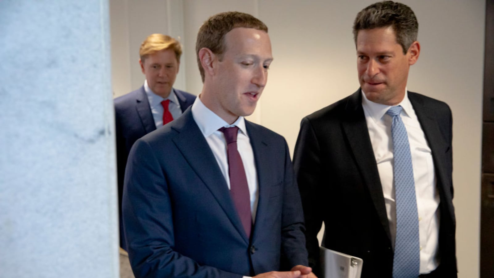 Facebook founder and CEO Mark Zuckerberg talks with the company’s Vice President of Global Public Policy, Joel Kaplan.
