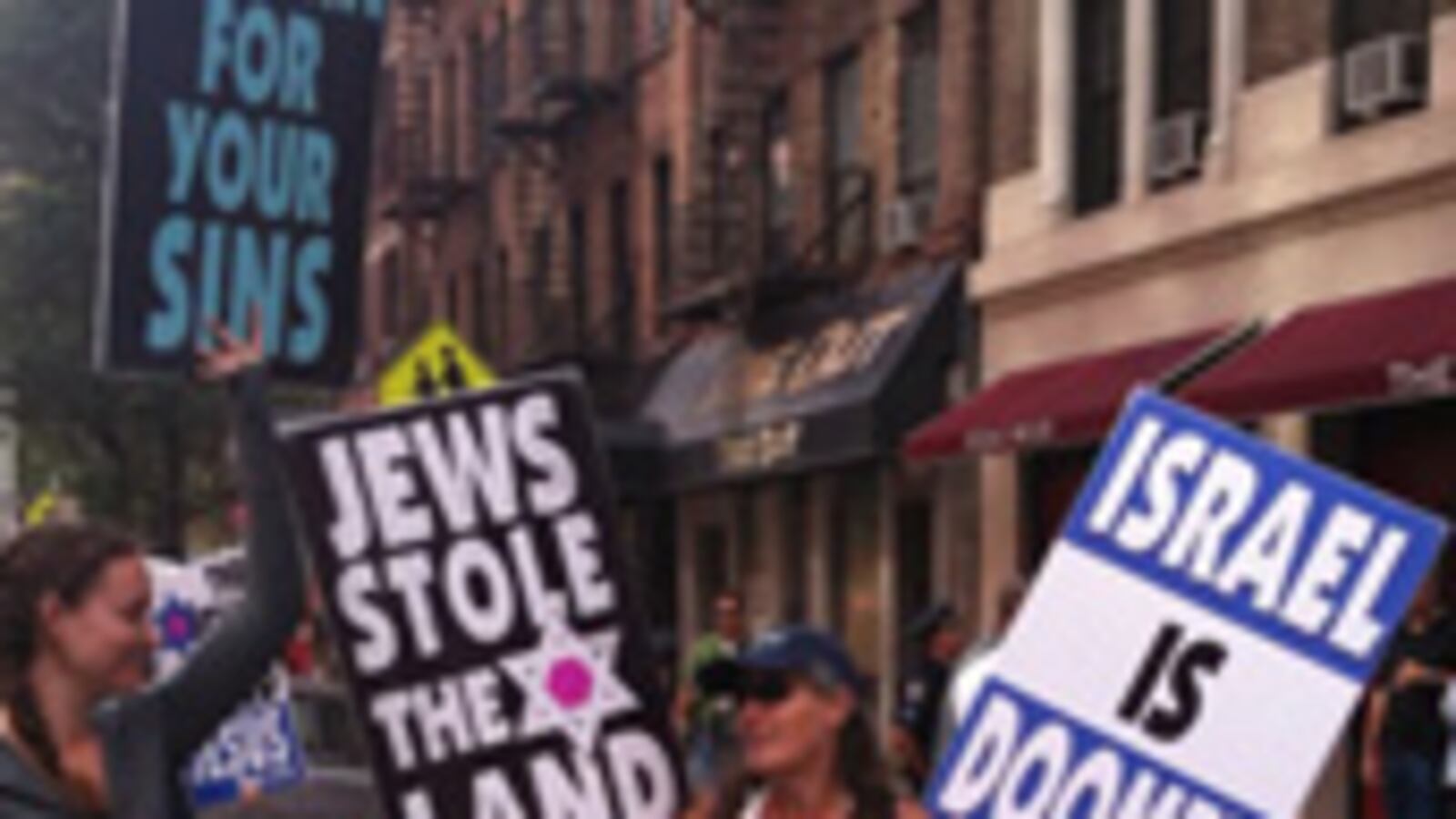 articles/2009/07/23/family-of-hate/avlon-cronkite-protesters_39590_ikn1gy