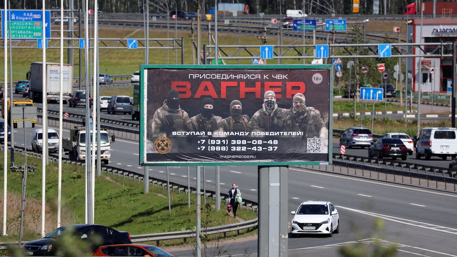 An advertising board promoting service in the Wagner private mercenary group is on display on the roadside on the outskirts of St. Petersburg, Russia, June 7, 2023. A slogan on the board reads: “Join Wagner group. Come to the winning team!”