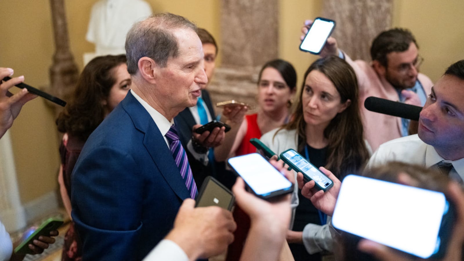 Sen. Ron Wyden, D-Ore., speaks to reporters as he leaves the Senate Democrats' lunch meeting in the U.S. Capitol.