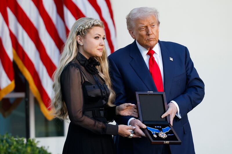 WASHINGTON, DC - OCTOBER 14: U.S. President Donald Trump posthumously awards the Presidential Medal of Freedom to late conservative activist Charlie Kirk as he presents the Medal to his wife Erika Kirk (L) during a ceremony in the Rose Garden of the White House on October 14, 2025 in Washington, DC. Today marks the National Day of Remembrance for Charlie Kirk who was shot and killed on September 10th at Utah Valley University. (Photo by Kevin Dietsch/Getty Images)