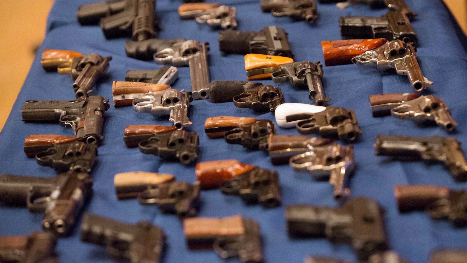 Guns lined up on a table