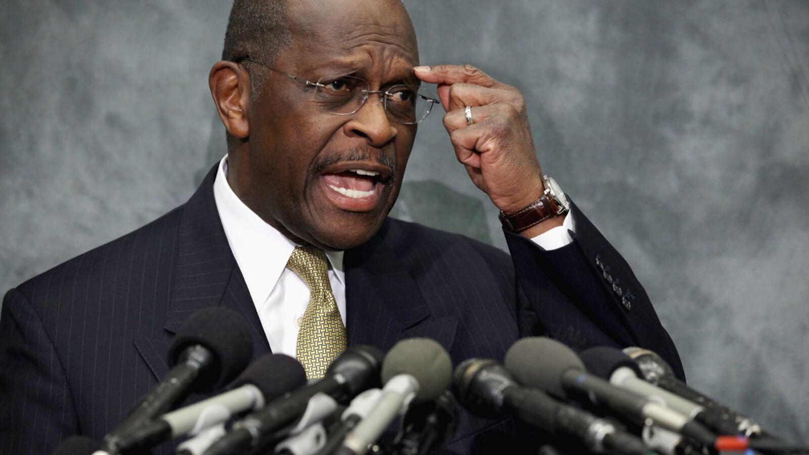 articles/2011/11/04/herman-cain-fashion-double-breasted-suits-don-t-fit-his-message/herman-cain-suit-givhan_llkmtg