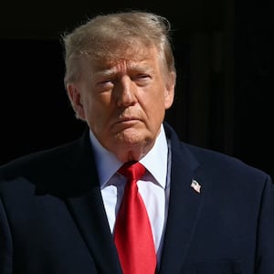President Donald Trump and First Lady Melania Trump look on before welcoming China's President Xi Jinping and his wife Peng Liyuan for tea at the White House, in Washington, DC, on September 25, 2026.