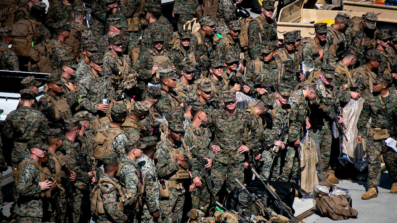 U.S. Marines with the 31st Marine Expeditionary Unit embark aboard the forward-deployed amphibious assault carrier USS Tripoli (LHA 7), at White Beach Naval Facility in Okinawa, Japan, Nov. 30, 2025.