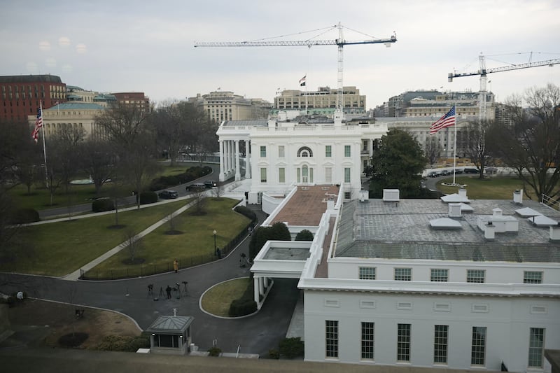 Cranes are seen on the grounds of the White House as construction work continues for President Donald Trump's new ballroom in Washington, DC, on February 25, 2026.