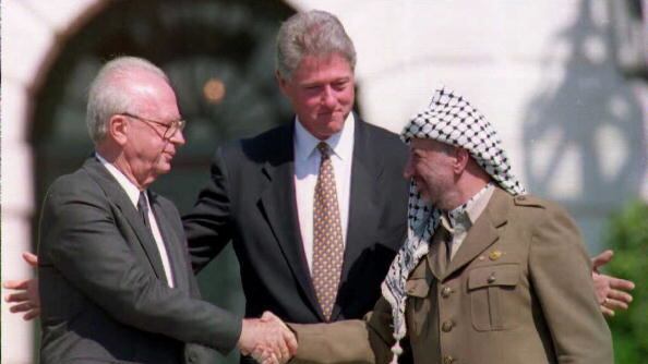 articles/2012/11/07/appoint-bill-clinton-peace-envoy/clinton-handshake-openz_qx9yue