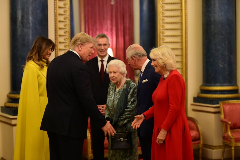 President Donald Trump and First Lady Melania with Queen Elizabeth II, then-Prince Charles and Camilla, Duchess of Cornwall, during a reception at Buckingham Palace to mark 70 years of the NATO Alliance on December 3, 2019.