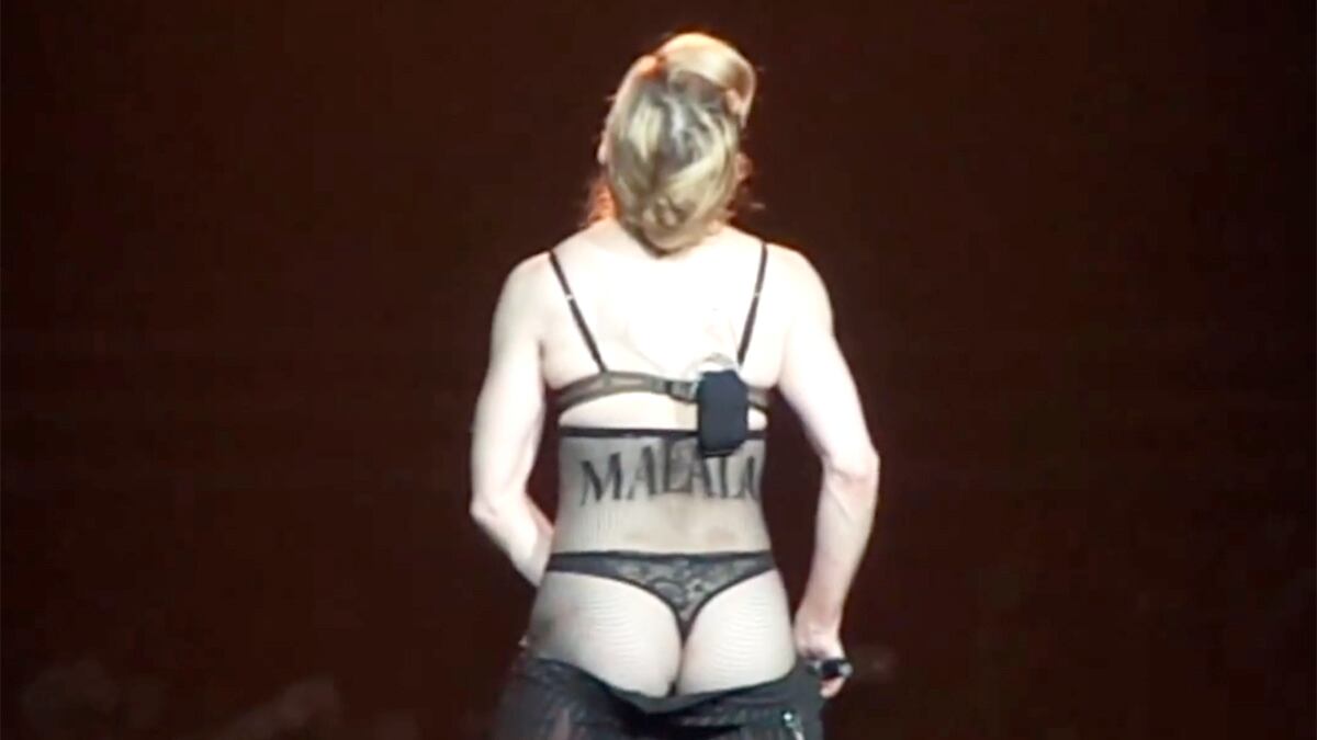 articles/2012/10/22/malala-with-friends-like-madonna/yousafzai-madonna-strips-youtube-tease_mlv7lc