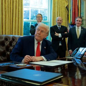 WASHINGTON, DC - APRIL 09: U.S. President Donald Trump signs an executive order as (L-R) U.S. Treasury Secretary Scott Bessent, Secretary of Commerce Howard Lutnick and Interior Secretary Doug Burgum look on in the Oval Office of the White House on April 09, 2025 in Washington, DC. President Trump signed several executive orders including directing the “repeal of unlawful regulations” and reducing “anti-competitive regulatory barriers.” Earlier today, Trump announced a 90-day pause on the full effect of his new tariffs for dozens of countries with the exception of China. (Photo by Anna Moneymaker/Getty Images)