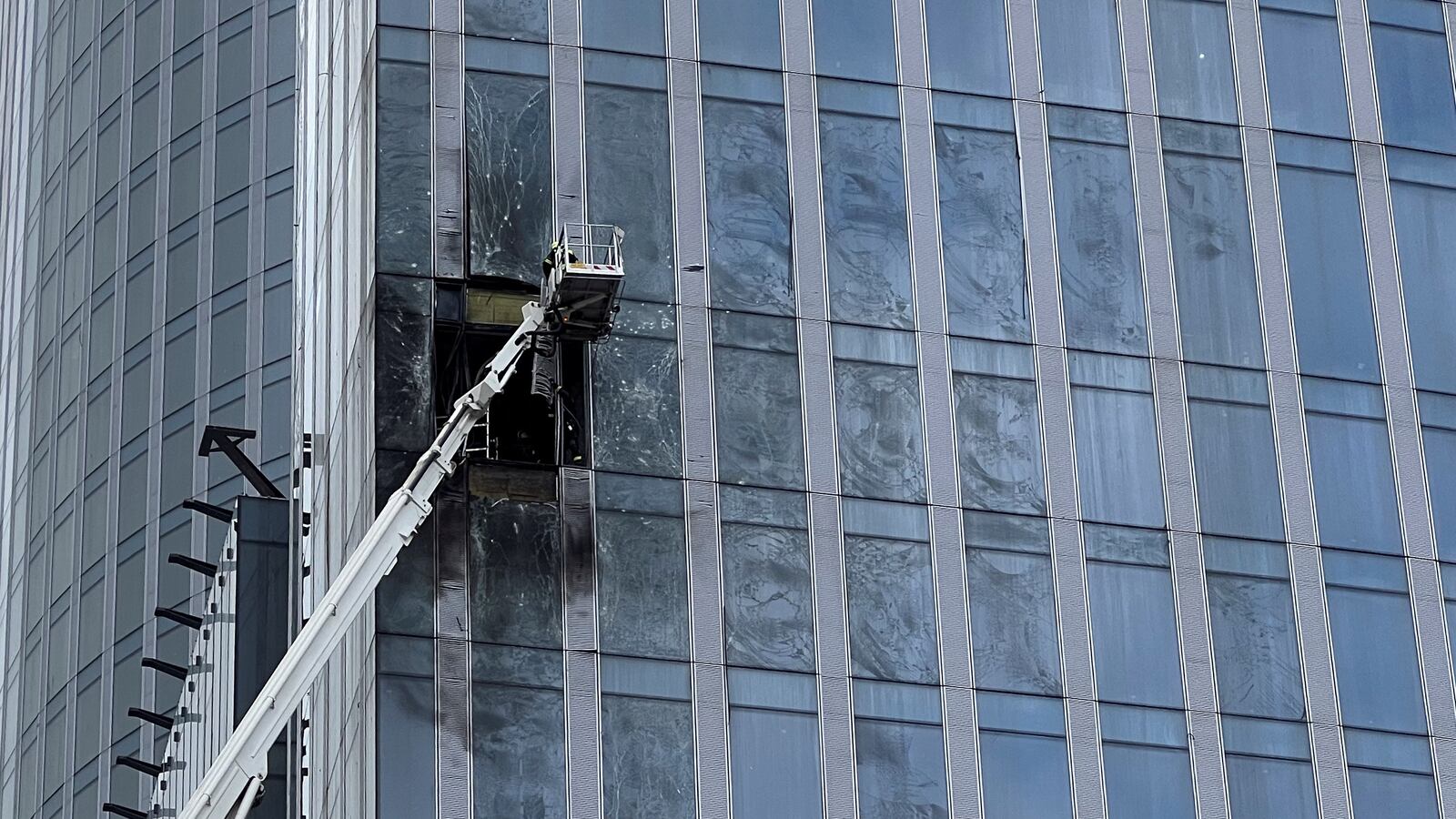 A view shows the damaged facade of a high-rise building in the Moscow City following an alleged Ukrainian drone attack in Moscow, Russia, August 23, 2023.