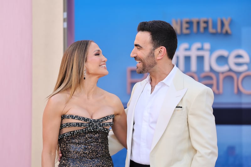 Jennifer Lopez and Brett Goldstein attend the world premiere of Netflix's Office Romance on May 26, 2026 in Los Angeles.