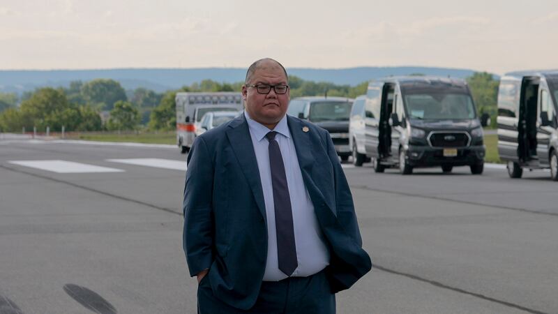 White House Communications Director Steven Cheung looks on as U.S. President Donald Trump walks off Air Force One at the Lehigh Valley International Airport on August 01, 2025 in Allentown, Pennsylvania.  Trump is traveling to Bedminster, New Jersey for the weekend. (Photo by Anna Moneymaker/Getty Images)