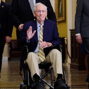 Senator Mitch McConnell waves at reporters outside the Senate Chamber after he returned to Capitol Hill  on September 14, 2026 for the first time in more than three months.