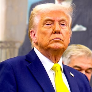 U.S. President Donald Trump, accompanied by Health and Human Services Secretary Robert F. Kennedy Jr. (L), takes a question