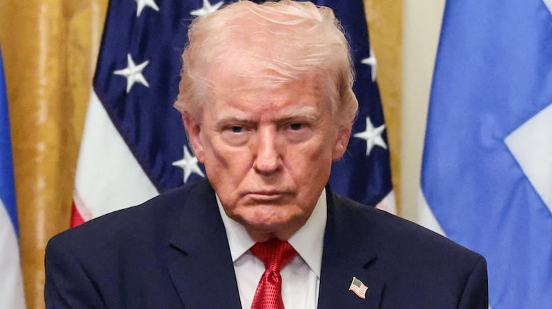 U.S. President Donald Trump, Archbishop Elpidophoros, Primate of the Greek Orthodox Archdiocese of America and U.S. Ambassador to Greece Kimberly Ann Guilfoyle attend a celebration in honor of Greek Independence Day in the East Room of the White House in Washington, D.C., U.S., March 26, 2026.