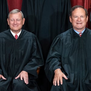Chief Justice of the United States John Roberts, left, and Associate Justice Samuel Alito, right, seated together for a photo.