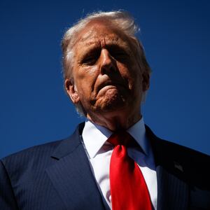 President Donald Trump speaks to reporters as he arrives at Palm Beach International Airport on October 31, 2025 in West Palm Beach, Florida.