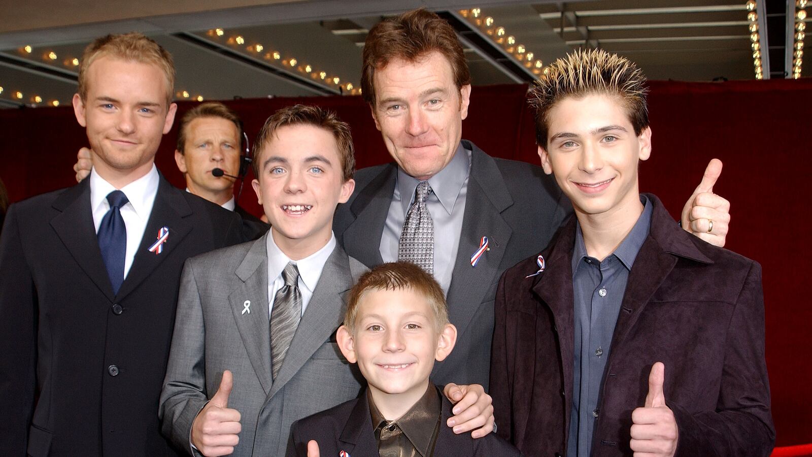 The cast of "Malcolm In The Middle" give a thumbs up sign at the 53rd Annual Primetime Emmy Awards at the Shubert Theater November 4, 2001 in Los Angeles, CA. (L-R) Actors Christopher Masterson, Frankie Muniz, Erik Per Sullivan (front center), Bryan Cranston and Justin Berfield.