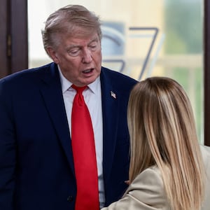 U.S. President Donald Trump speaks with Italian Prime Minister Giorgia Meloni at a working lunch with leaders of G7 and the Middle East, in Evian-les-Bains, France, June 16, 2026. REUTERS/Evelyn Hockstein/Pool