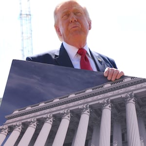 U..S. President Donald Trump shows an image of the concept at the site of ongoing construction of the planned White House ballroom in Washington, D.C., U.S., May 19, 2026.