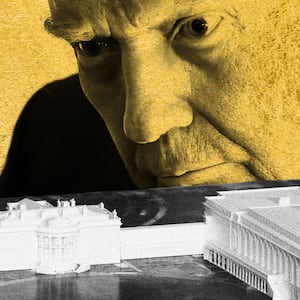 Donald Trump looking at a model of the proposed white house east wing renovation