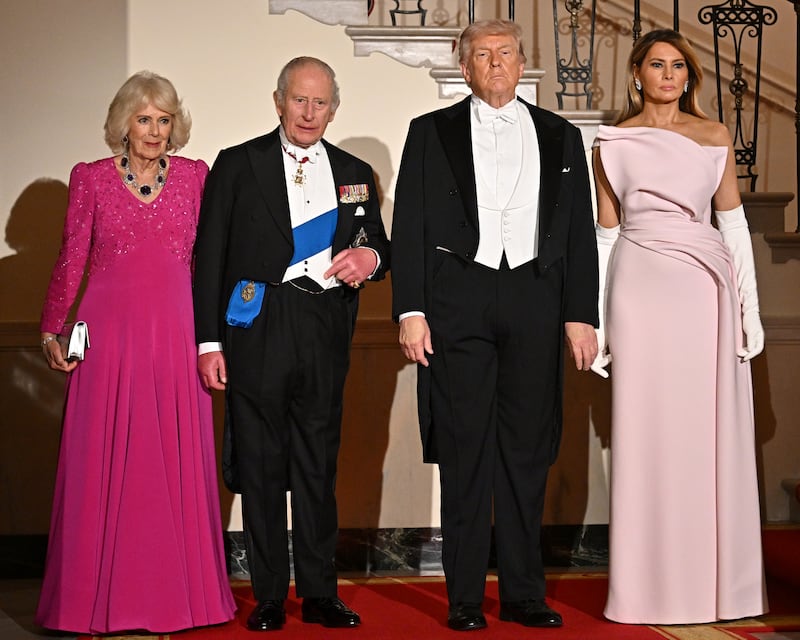 WASHINGTON, DC - APRIL 28: (L-R) Queen Camilla, King Charles III, U.S. President Donald Trump, and First Lady Melania Trump pose on Grand Staircase during an official state dinner hosted by the President and First Lady at The White House on day two of the State Visit of King Charles III and Queen Camilla to the United States of America, on April 28, 2026 in Washington, DC. The dinner is the first formal white tie event at The White House since President George W. Bush hosted Queen Elizabeth II in 2007.  (Photo by Samir Hussein/WireImage)
