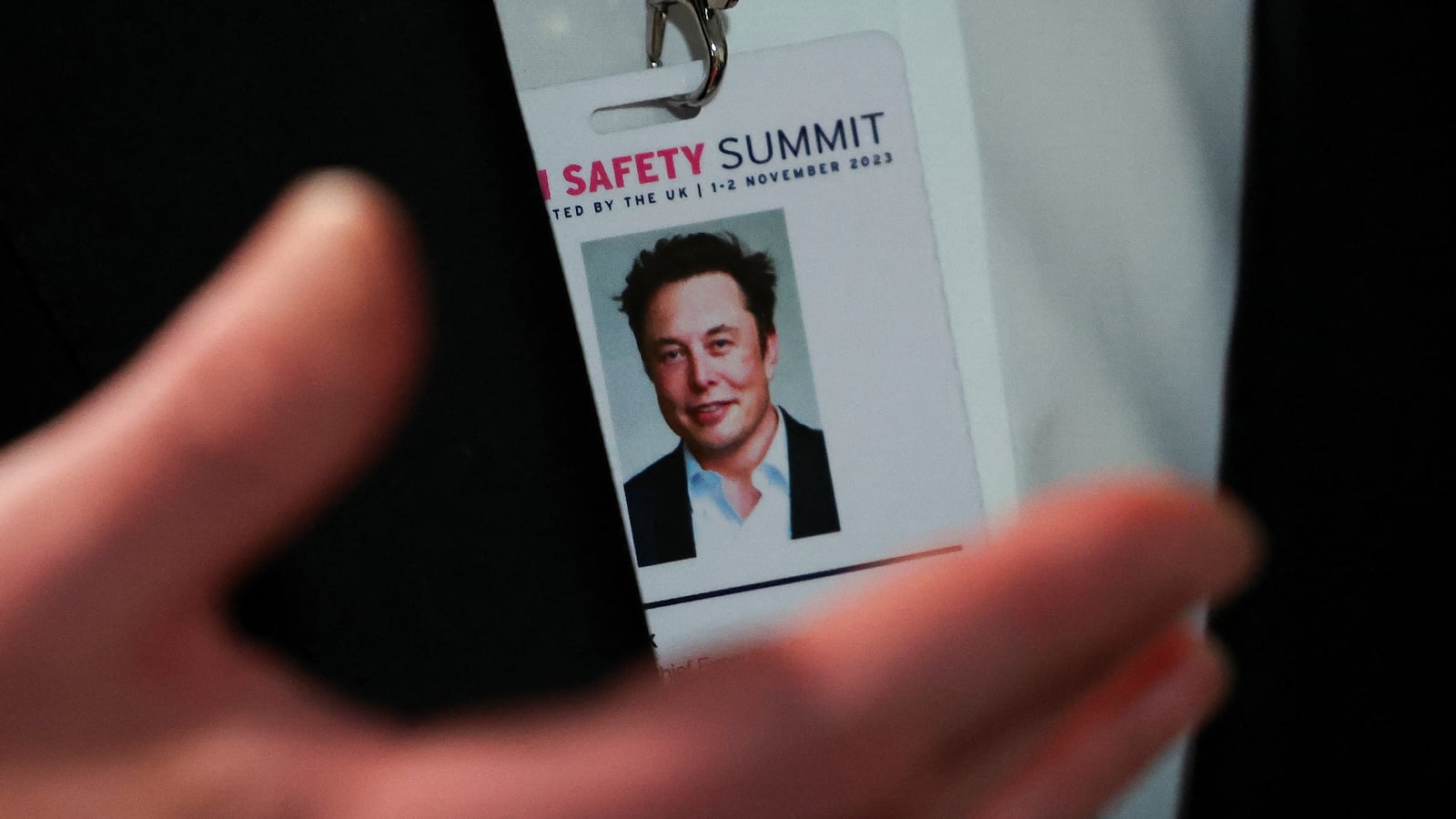 Elon Musk, CEO of Tesla and X gestures as he attends the AI Safety Summit in Bletchley Park