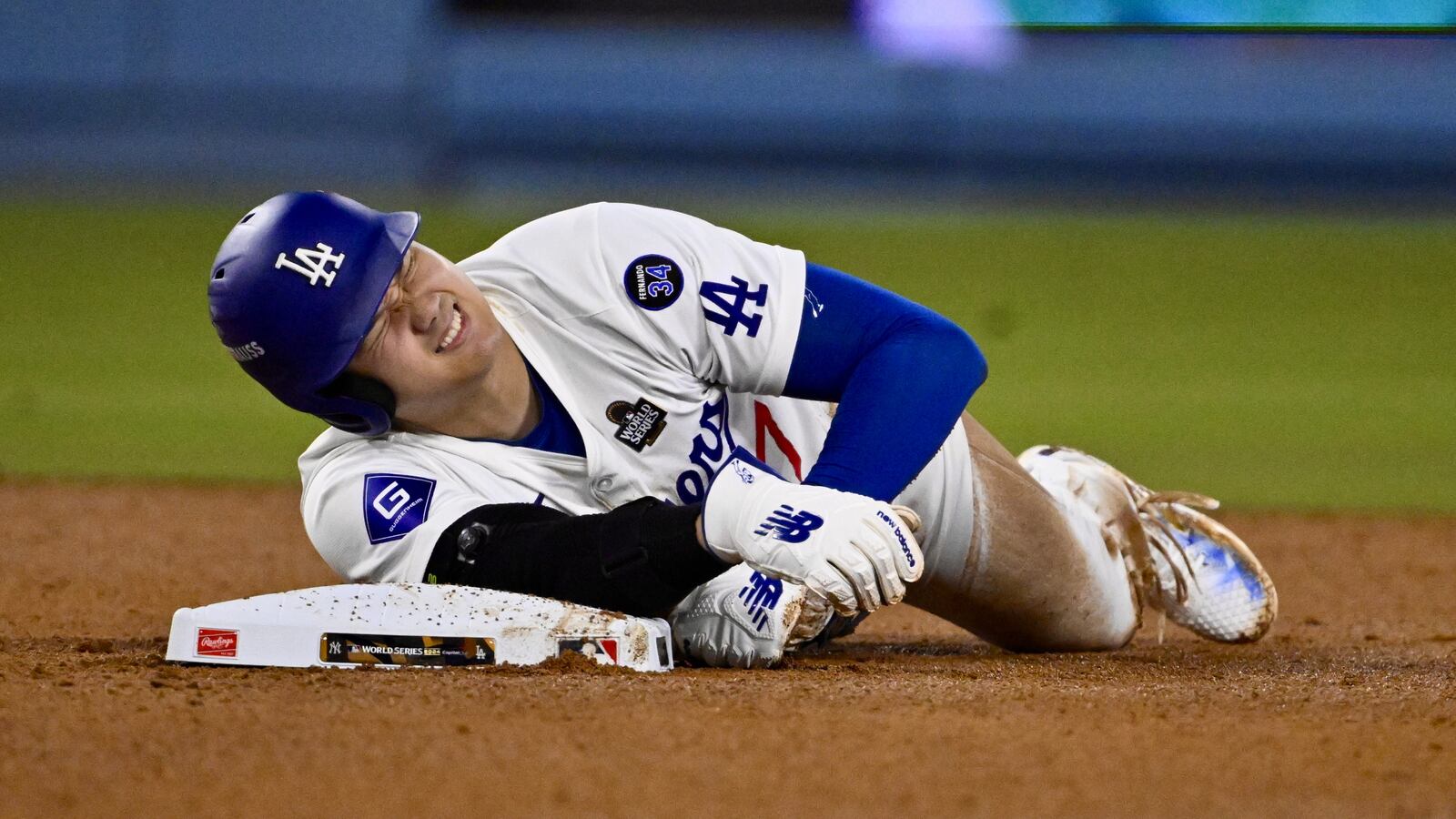 Los Angeles, CA - October 26: Shohei Ohtani (17) of the Los Angeles Dodgers reacts after being injured on the play and would leave the game after being tagged out at second base against the New York Yankees in the seventh inning during Game 2 of a World Series baseball game at Dodger Stadium on Saturday, October 26, 2024.