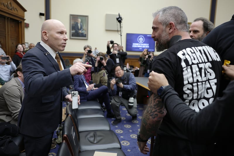 Far-right operative Ivan Raiklin confronts former Metropolitan Police Department officer Michael Fanone during a recess in the testimony of Special Counsel Jack Smith at a hearing before the House Judiciary Committee on Capitol Hill on January 22, 2026.
